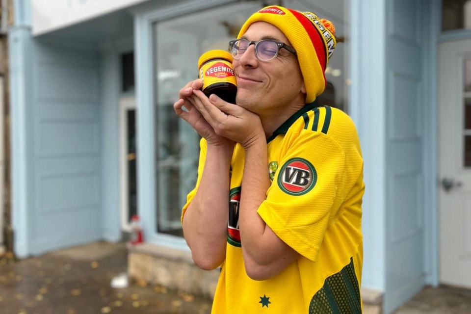 Founder Leighton Walters outside of Guelph's Gordon Street location with a jar of his beloved Vegemite. 
