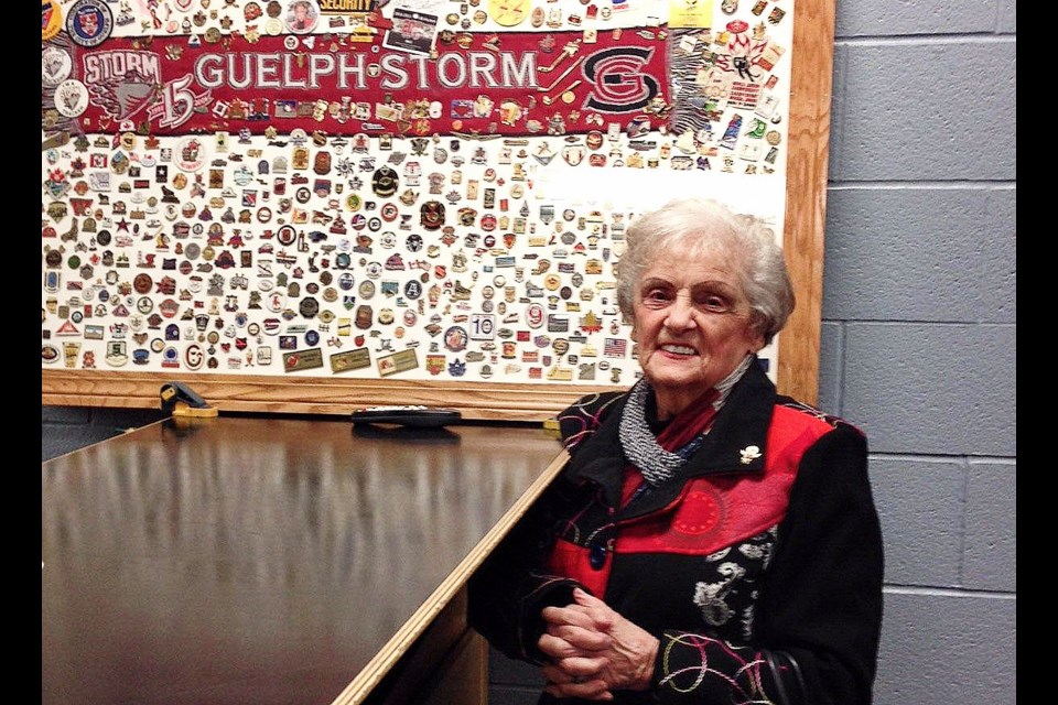 Rita Campbell poses with some of the countless pins she collected working as an usher for 60 years in Guelph rinks. Submitted photo