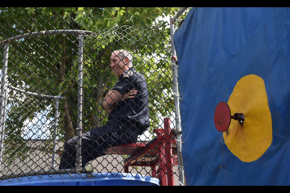 Guelph Police Chief Jeff DeRuyter is nice a dry as he enters the dunk tank. (Rob O'Flanagan/GuelphToday)