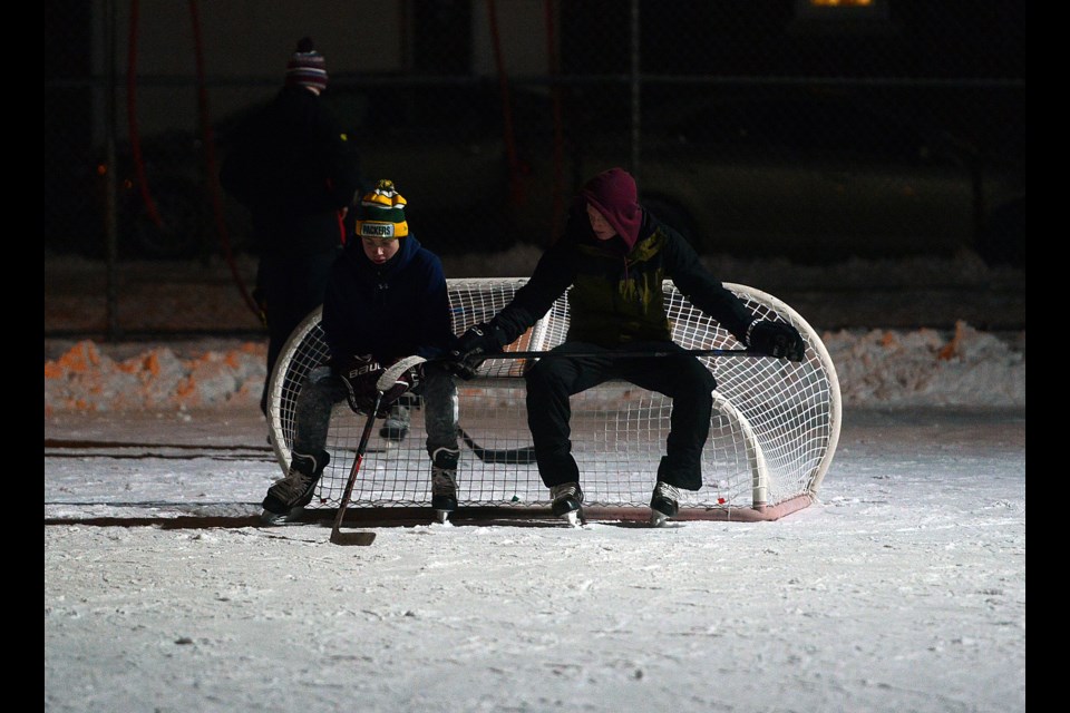 Taking a breather after some night shinny at Sunnyacres Park. Tony Saxon/GuelphToday