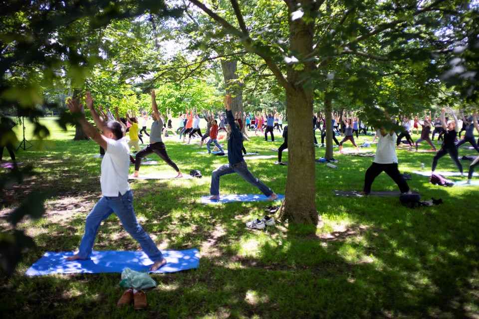 About 100 people participated in an event marking the International Day of Yoga on Friday at Johnston Green. The event was followed by a yoga picnic. Kenneth Armstrong/GuelphToday
