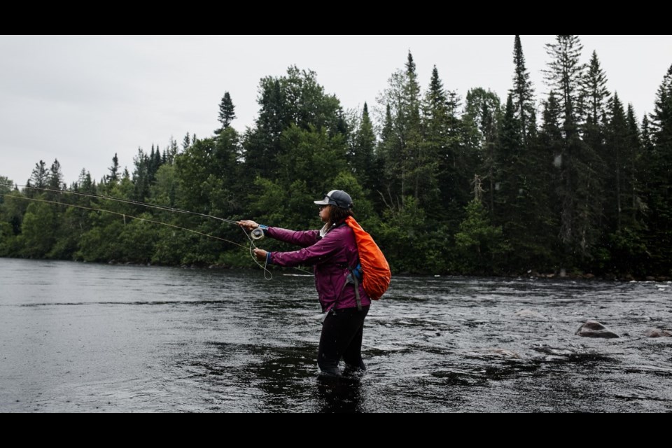 Dionne Daley casting her line while out fly fishing. Gabriel Bizeau Photographie photo