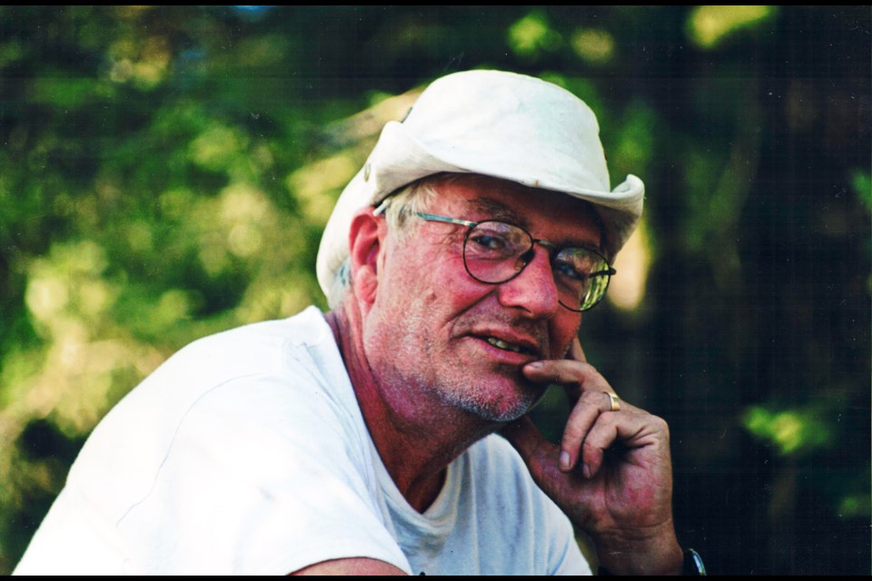 Keith Lymburner outside in a white hat and shirt.