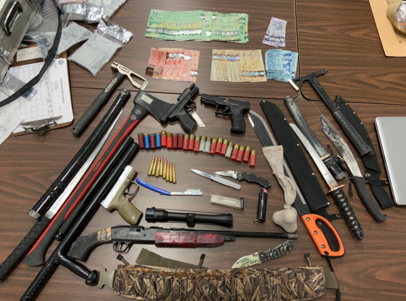 Cash, replica firearms and drugs seized by Guelph Police last Thursday. Guelph Police photo