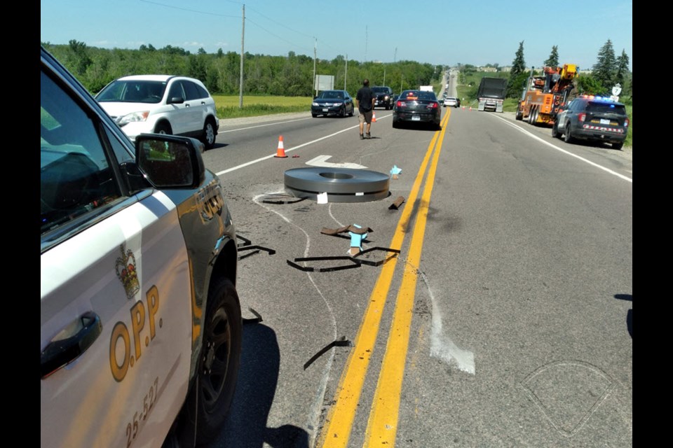 Two coils fell off of a tractor trailer, blocking traffic west of Guelph on June 23, 2022.