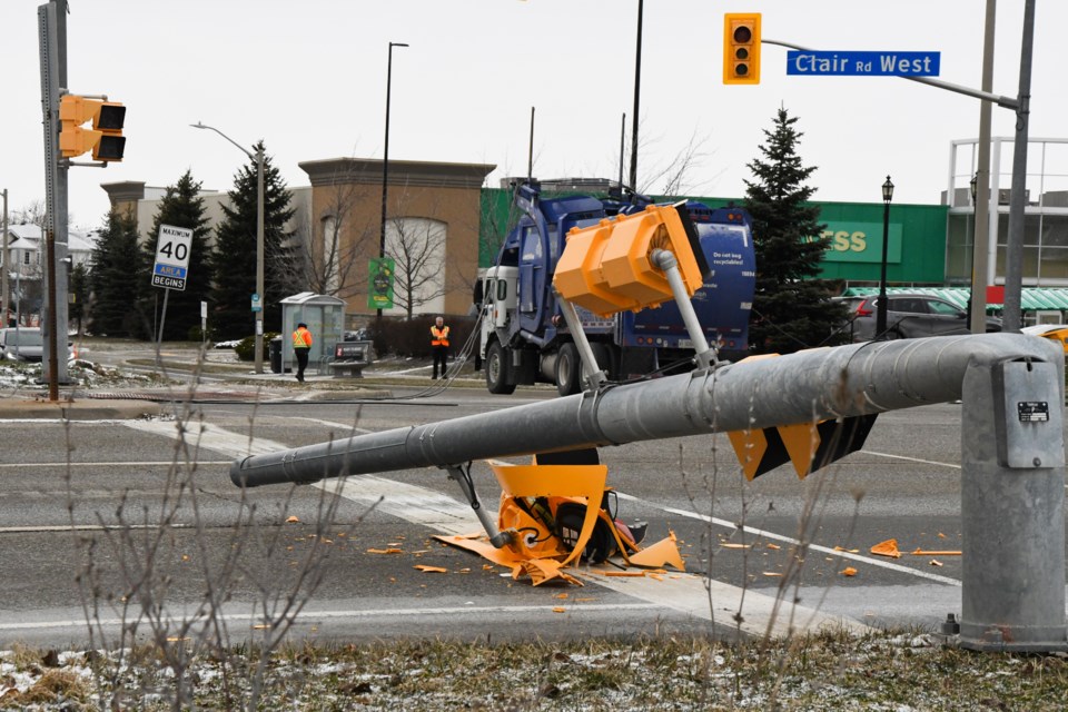 A waste collection truck snagged overhead wires in the area of Clair Road West and Gosling Gardens on Thursday morning, pulling down two traffic signal poles.