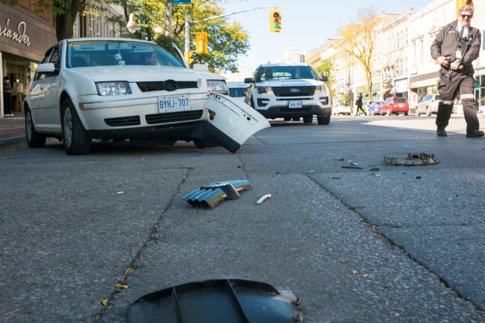 Debris is strewn across part of Wyndham Street after an apparent collision between a car and a Guelph Transit bus Monday afternoon. Kenneth Armstrong/GuelphToday