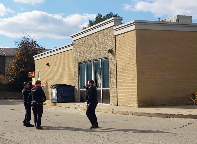 Police on the scene of a Friday bank robbery on Stone Road.