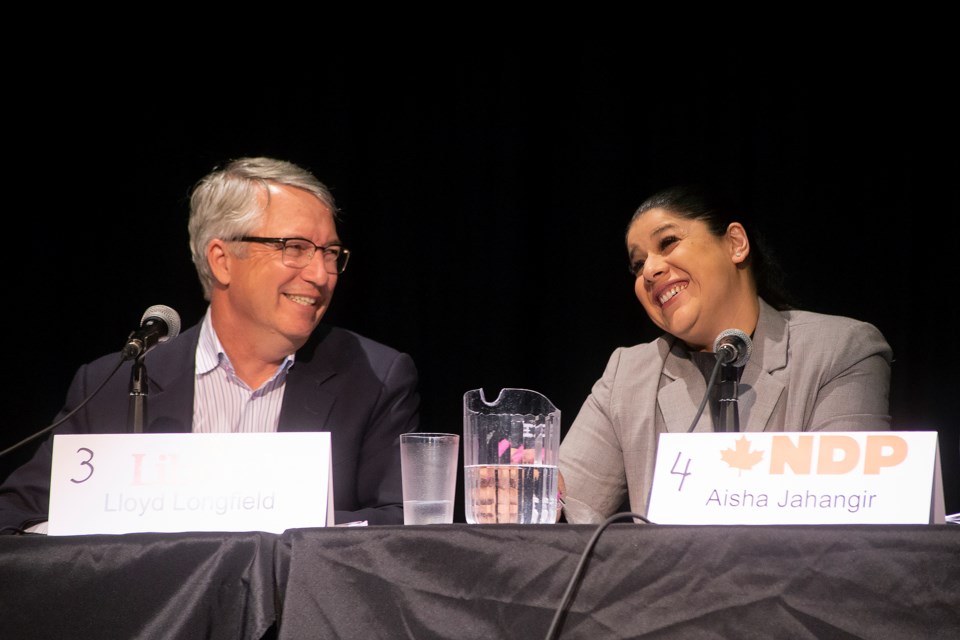 Liberal incumbent Lloyd Longfield and Aisha Jahangir of the NDP laugh during Thursday's '100 Debates on the Environment' event held at Centennial CVI. Kenneth Armstrong/GuelphToday