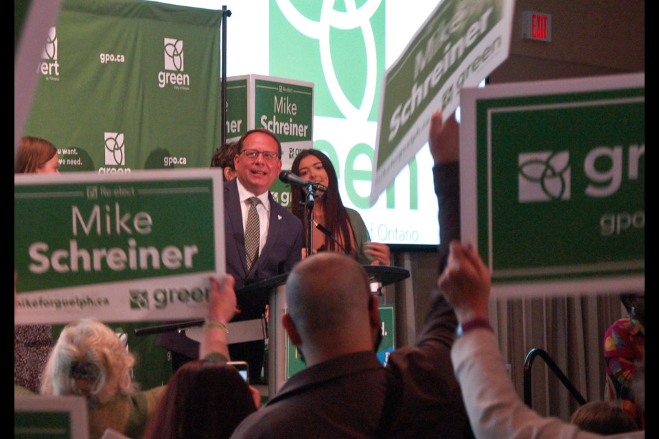 Mike Schreiner celebrates his election win Thursday night at the Delta Hotel.