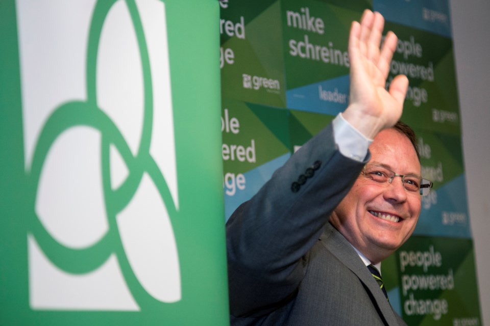 Mike Schreiner, leader of the Green Party of Ontario and provincial candidate for Guelph, waves to supporters during a town hall event at 10C on Tuesday as a kick-off to the party's Green Vision Tour. Kenneth Armstrong/GuelphToday