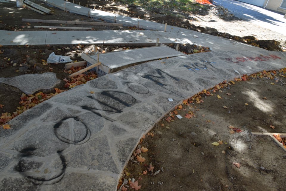 Newly laid limestone on the Garden of Grace next to Basilica of Our Lady has been spray painted with graffiti. Rob O'Flanagan/GuelphToday