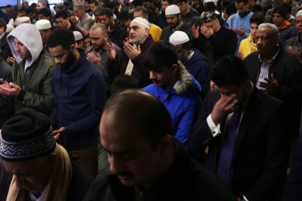 People listen during Friday prayer at the Muslim Society of Guelph. The public was invited to Friday prayer in response to the New Zealand mosque shootings that occurred Thursday evening local time. Kenneth Armstrong/GuelphToday 