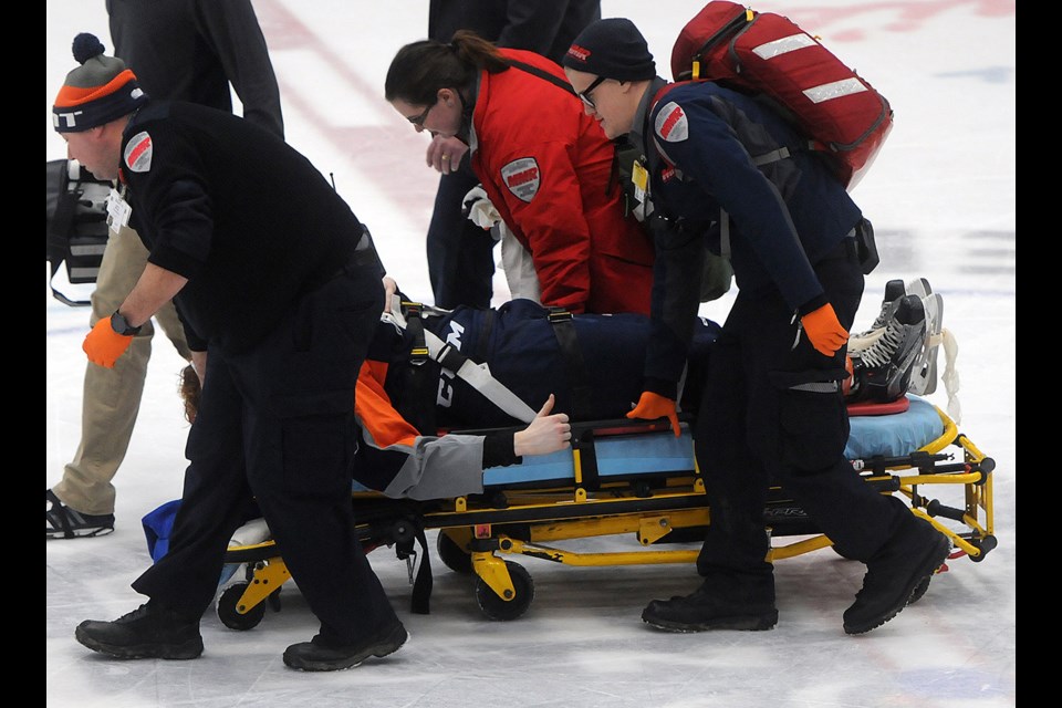 Injured Flint Firebirds player Jack Phibbs gives the thumbs up to the crowd and teammates as he is stretchered off the ice in Flint after colliding with a Guelph Storm player Sunday, Feb. 12, 2017, in Flint. He was reportedly okay. Tony Saxon/GuelphToday