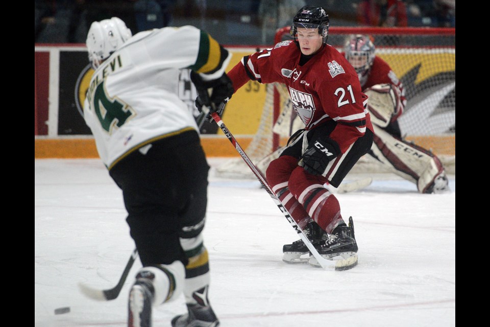 James McEwan of the Guelph Storm braces for a shot by the London Knights' Olli Juolevi Sunday, Feb. 26, 2017, at the Sleeman Centre. Tony Saxon/GuelphToday