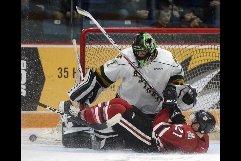James McEwan of the Guelph Storm slides into London Knights goaltender Tyler Parsons after being tripped on a breakaway Sunday, March 12, 2017, at the Sleeman Centre. Tony Saxon/GuelphToday