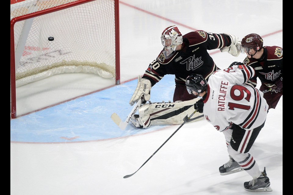 Isaac Ratcliffe of the Guelph Storm fires a rebound past Peterborough Petes goaltender Dylan Wells for his second goal of the game Thursday, Dec. 28, 2017, at the Sleeman Centre. Tony Saxon/GuelphToday