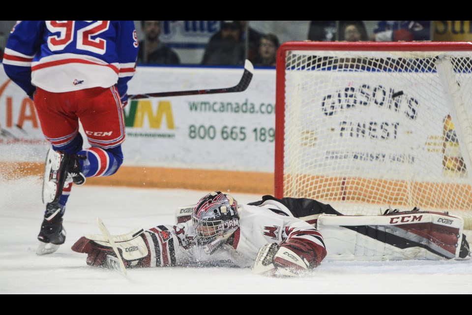 Guelph Storm goaltender Anthony Popovich is down and out as Kitchener's Kole Sherwood scores Friday at The Aud. Tony Saxon/GuelphToday