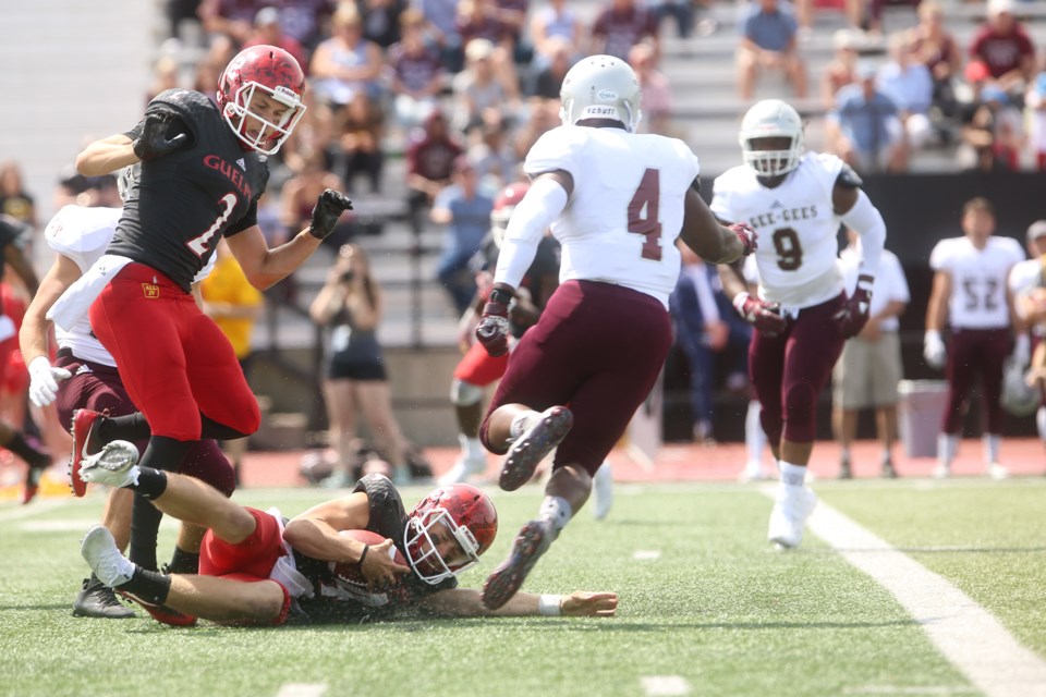 Gryphons quarterback James Roberts seen sliding to gain yardage during a game against the visiting Ottawa Gee-Gees on Sunday. Kenneth Armstrong/GuelphToday