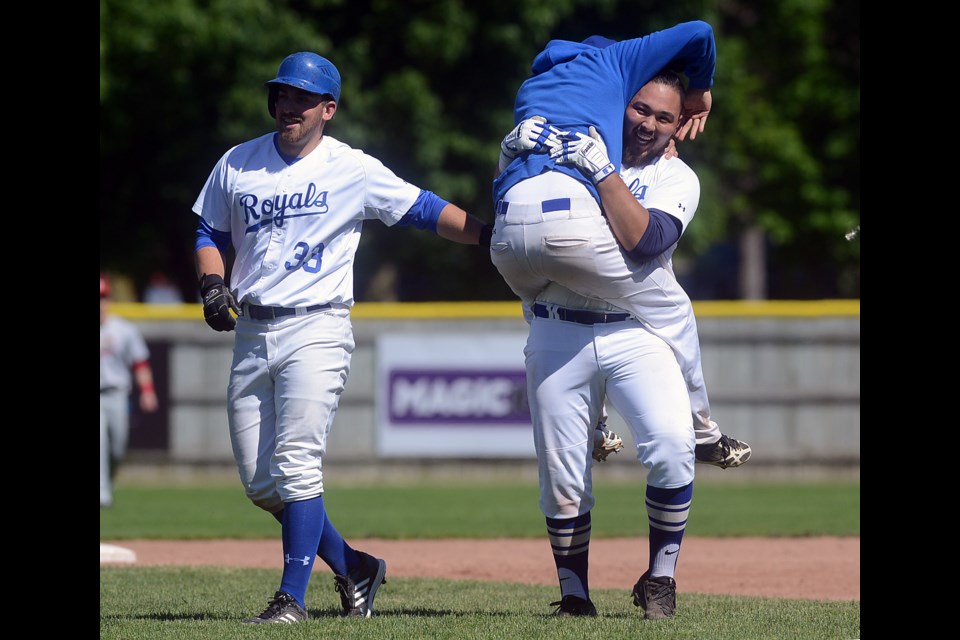 Chris Nakashima of the Guelph Royals is congratulated by teammates after delivering the winning hit in a 4-3 win over the Hamilton Cardinals Saturday, June 3, 2017, at Hastings Stadium. It was Guelph's first win of the season. Tony Saxon/GuelphToday