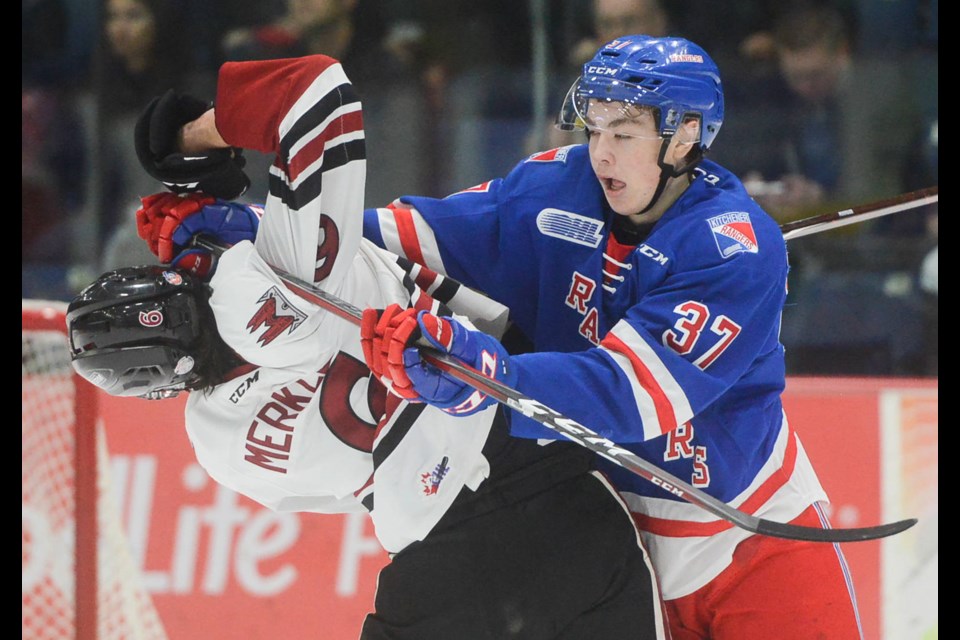 The Guelph Storm's Ryan Merkley mixes it up with a Kitchener Rangers player. Tony Saxon/GuelphToday