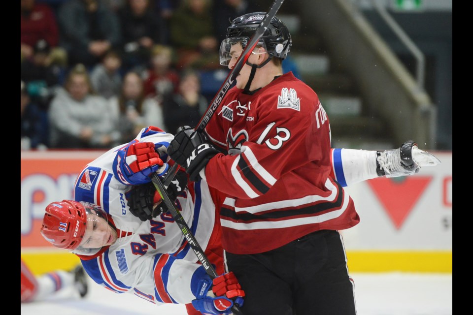 Cole Cameron of the Kitchener Rangers is upended after taking a run at the Guelph Stormn's Alexey Toropchenko Friday at the Sleeman Centre. Tony Saxon/GuelphToday