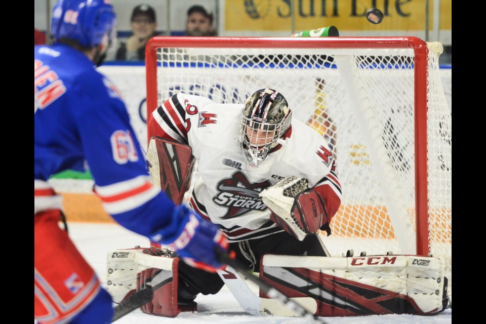 Guelph Storm goaltender Anthony Popovich makes a save late in the game on Kitchener's Mike Petizian Tuesday at The Aud. Tony Saxon/GuelphToday