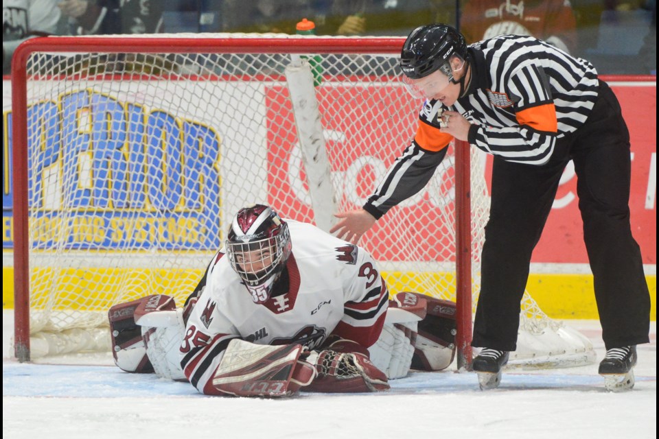 The referee checks on Guelph Storm goaltender Nico Daws after a collision Friday at the Sleeman Centre. Tony Saxon/GuelphToday