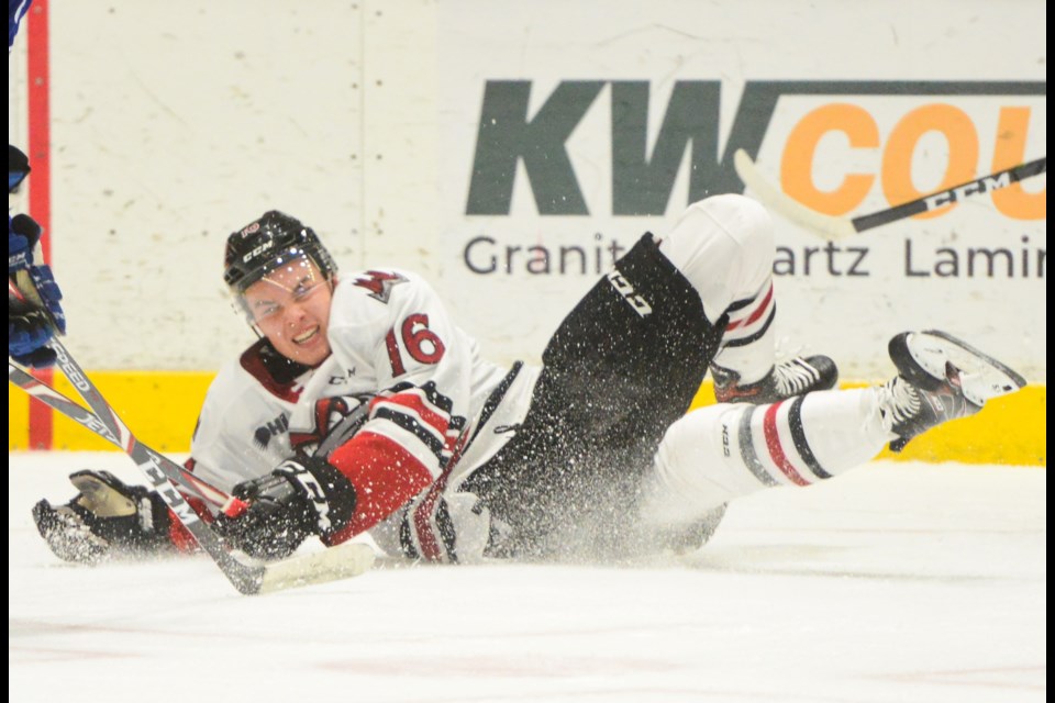 The Guelph Storm's Eric Uba crashes to the ice after being upended by a Mississauga Steelheads player Sunday at the Sleeman Centre. Tony Saxon/GuelphToday