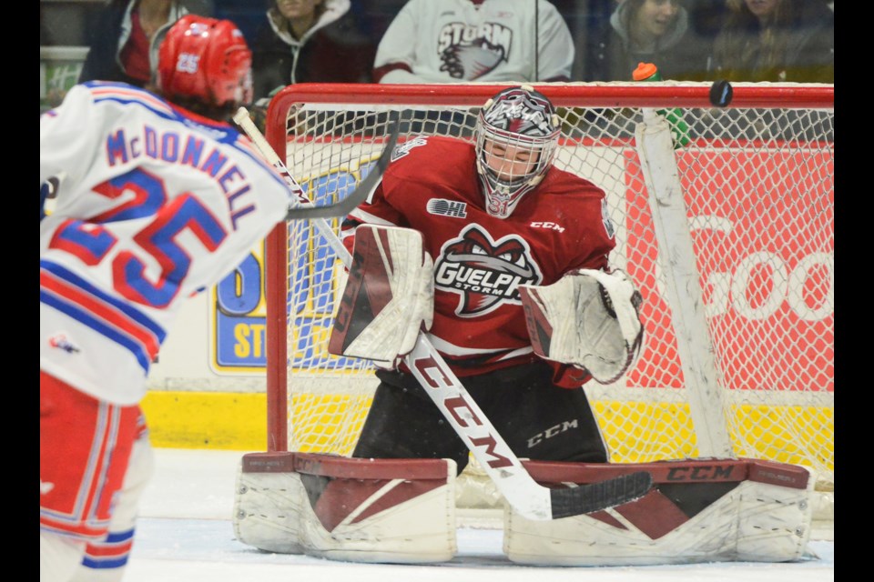 Guelph Storm goaltender Owen Bennett makes a save on Kitchener's Declan McDonnell in the first period Wednesday at the Sleeman Centre. Tony Saxon/GuelphToday