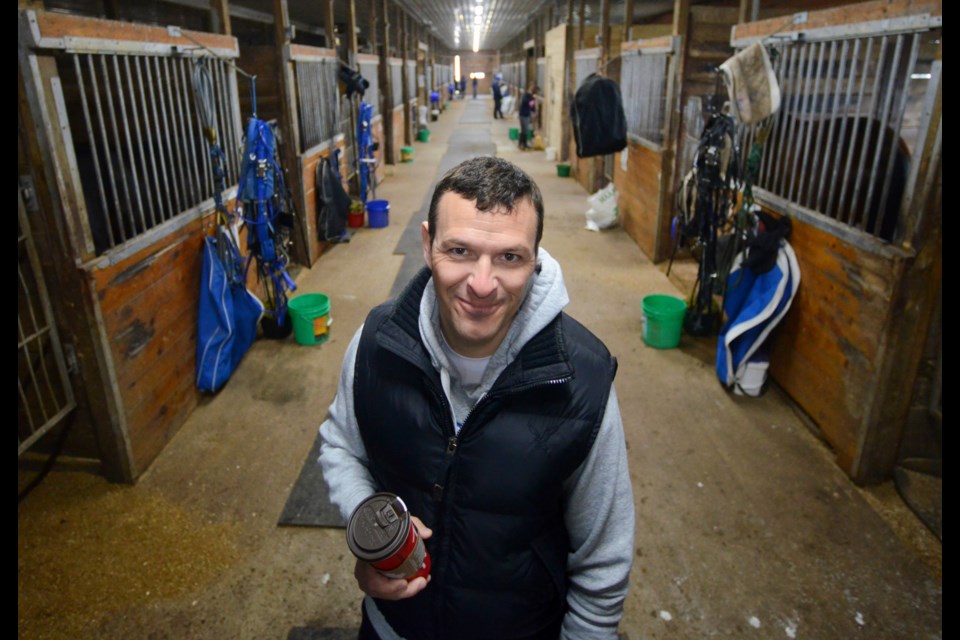 Anthony MacDonald poses in one of the barns at Tomiko Harness Centre south of Guelph. Tony Saxon/GuelphToday