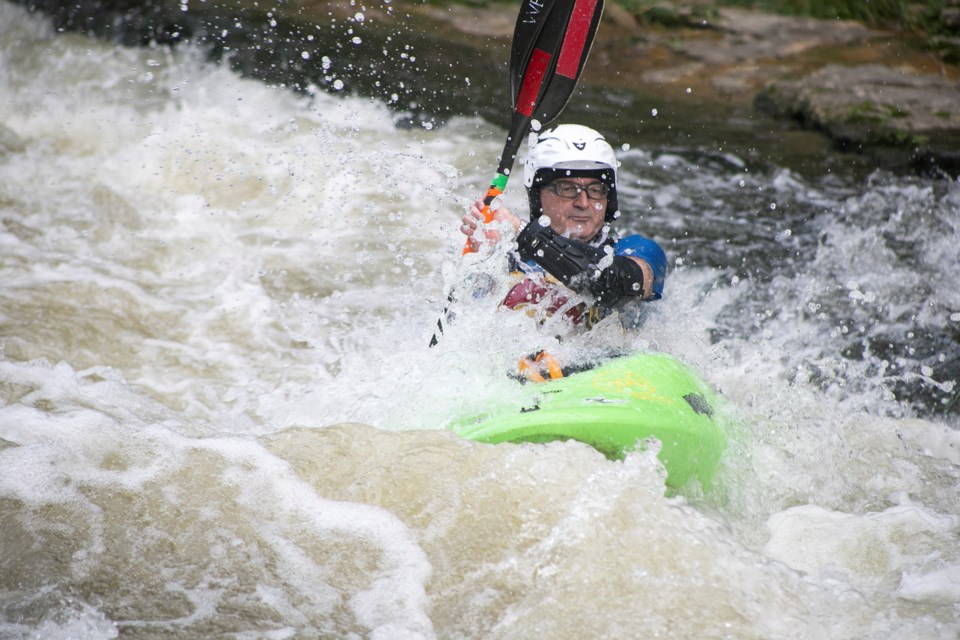 Koorus Bookan makes his way down the rapids near the tube launch at the Elora Conservation Area. Kenneth Armstrong/GuelphToday