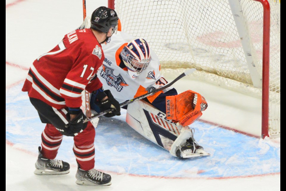 Flint Firebirds goaltender Nathaniel Day makes a huge save in overtime on the Guelph Storm's Danny Zhilkin Friday at the Sleeman Centre.