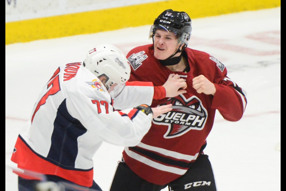 The Guelph Stom's Cam Allen fights the Windsor Spitfires' James Jodoin Friday at the Sleeman Centre.
