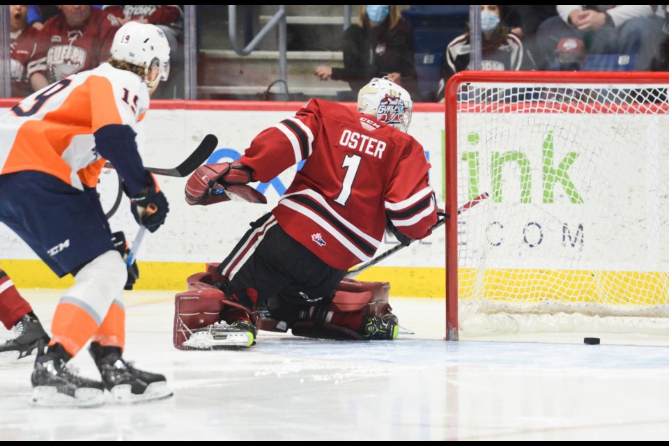 The puck squirts behind Guelph Storm goaltender Jacob Oster after coming off the end boards and just before being poked into the Guelph Storm net just 12 seconds into Sunday's game at the Sleeman Centre.
