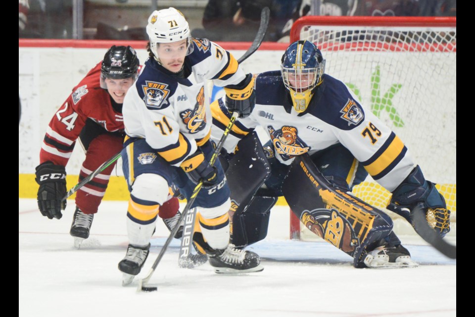 Colby Saganiuk of the Erie Otters clears a loose puck away from in front of his net Monday night at the Sleeman Centre.