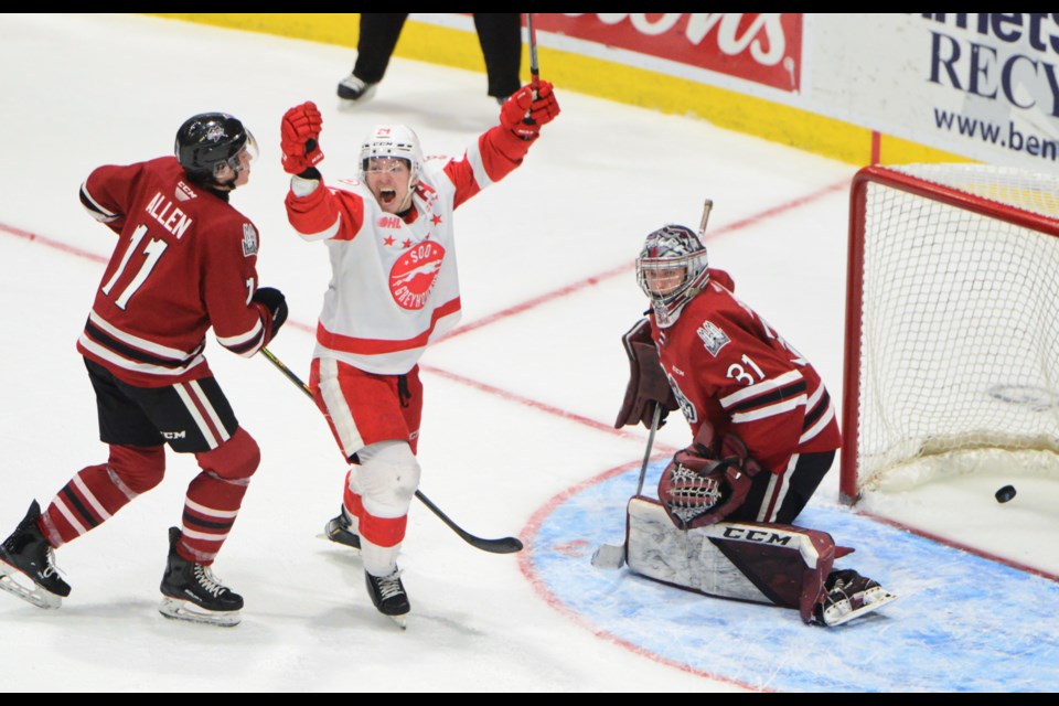 Cole MacKay of the Sault Ste. Marie Greyhounds celebrates the winner in overtime Thursday at the Sleeman Centre.