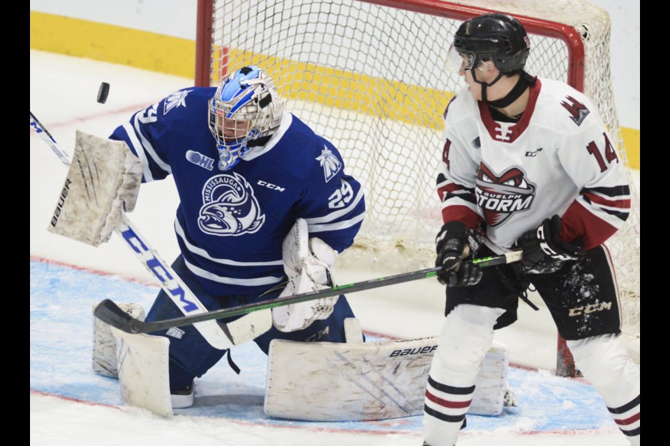 The Guelph Storm's Matt Poitras watches as a shot goes just wide of Mississauga goaltender Justin Dilauro Friday at the Sleeman Centre.