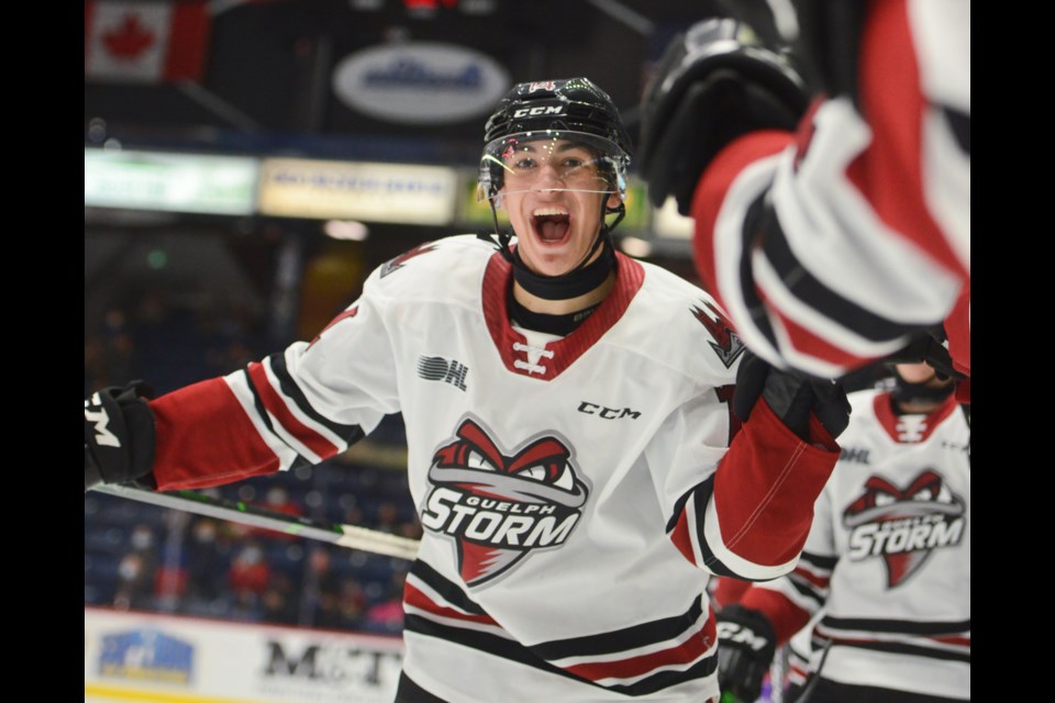 Guelph Storm forward Matt Poitras celebrates at the bench after scoring against the Sault Ste. Marie Greyhounds Saturday at the Sleeman Centre.