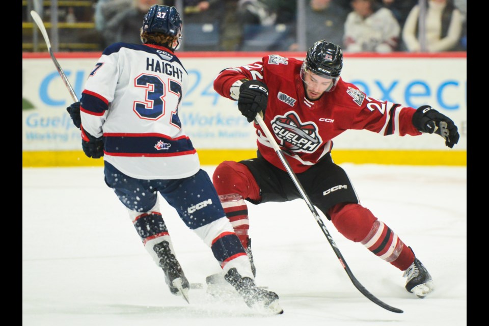 Hunter Haight of the Saginaw Spirit makes a move around Guelph Storm defenceman Tommy Budnick Sunday at the Sleeman Centre.