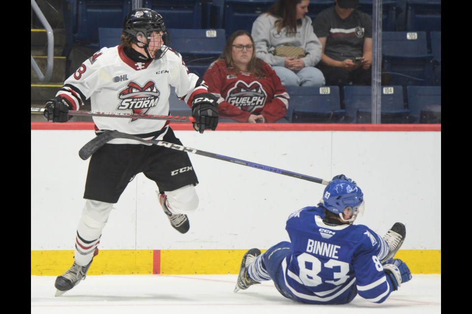 Rowan Topp levels a Mississauga player in Saturday's exhibition game.