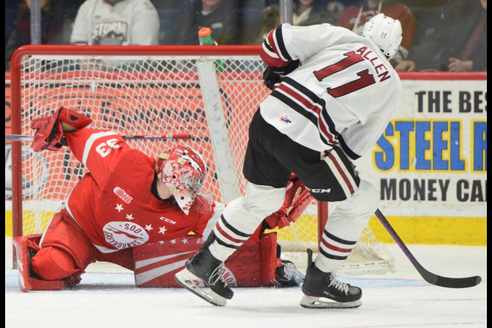 Soo Greyhounds goaltender Samuel Ivanov stops the Guelph Storm's Cam Allen in close Saturday afternoon at the Sleeman Centre.