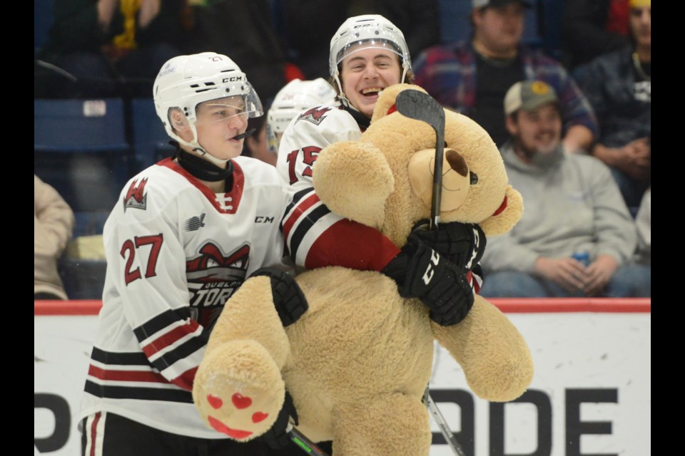 The Guelph Storm's Braeden Bowman, right, and Valentin Zhugin share a laugh after the teddy bears came raining down at the Sleeman Centre Saturday afternoon on Teddy Bear Toss night.
