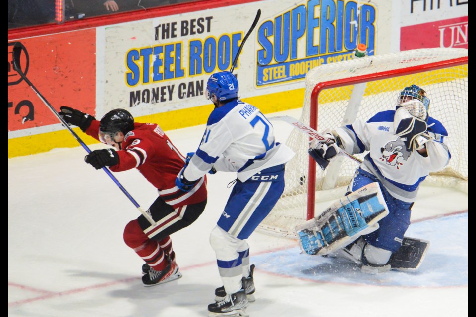 The Guelph Storm's Matt Poitras beats Sudbury Wolves goaltender Kevin Brassard or the winning goal on a breakaway in overtime Sunday at the Sleeman Centre.