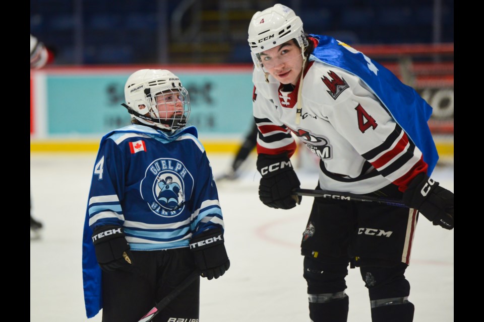 Michael Buchinger and Emma were chosen as the stars of the game and did a lap of the ice wearing their capes.