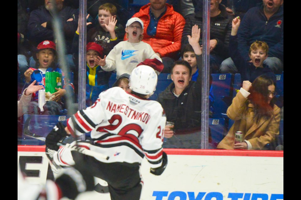 Guelph Storm forward Max Namestnikov celebrates his first period goal with some fans at the Sleeman Centre Friday night.