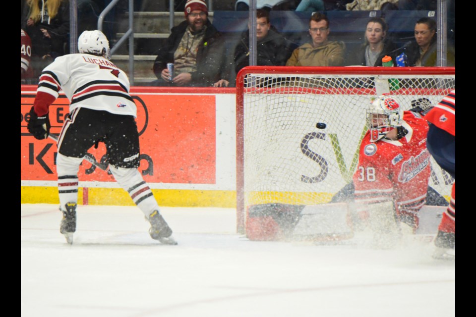 The Guelph Storm's Jett Luchanko backhands the puck into the net past Oshawa Generals goaltender Jacob Oster Sunday afternoon at the Sleeman Centre.
