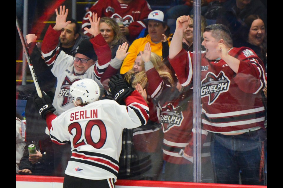 Leo Serlin and friends celebrate his first period goal at the Sleeman Centre Sunday.