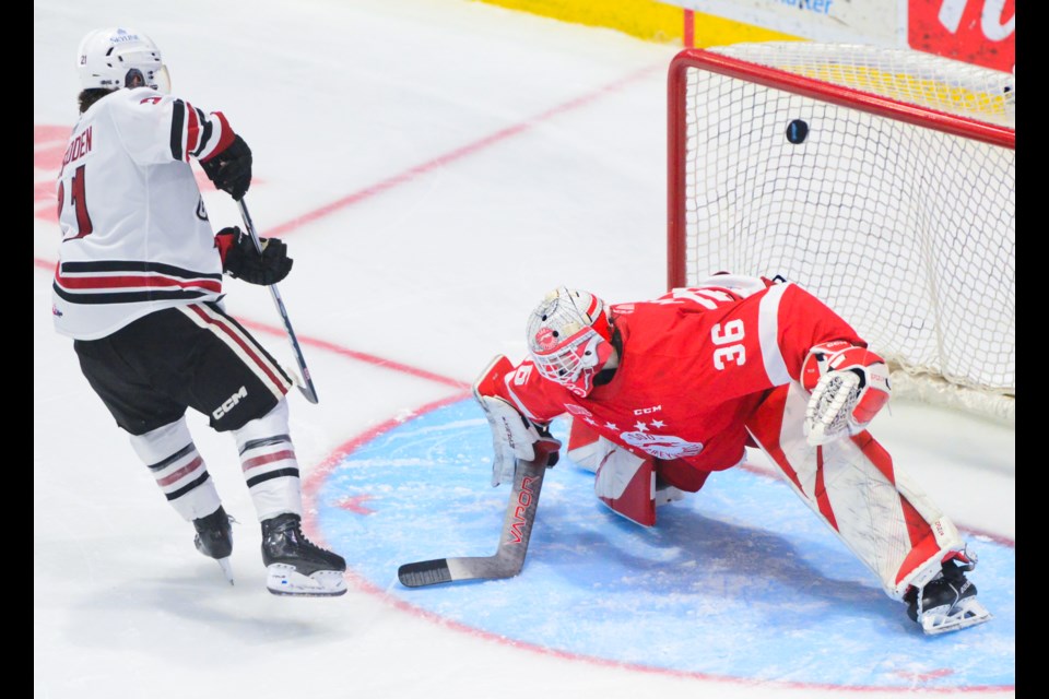 Guelph's Wil McFadden buries what turned out to be the deciding goal in the shootout past Sault Ste.  Marie Greyhounds goaltender Landon Miller.
