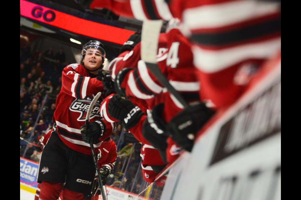 Charlie Paquette gets high fives at the Guelph Storm bench after scoring against the Erie Otters Friday at the Sleeman Centre.